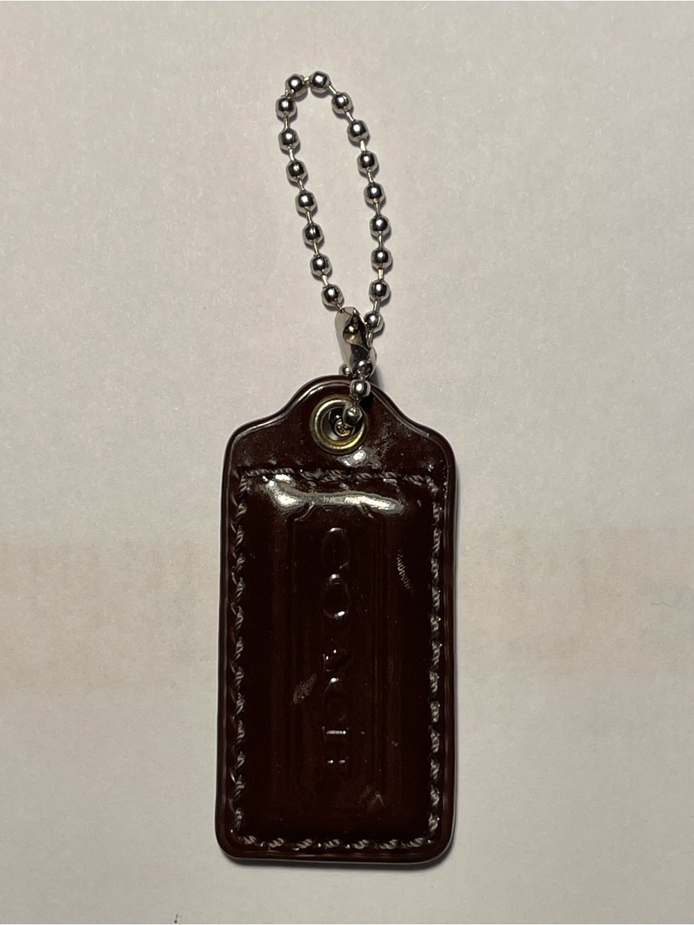 Coach Dark Brown Patent Leather Hang Tag with Bead Chain